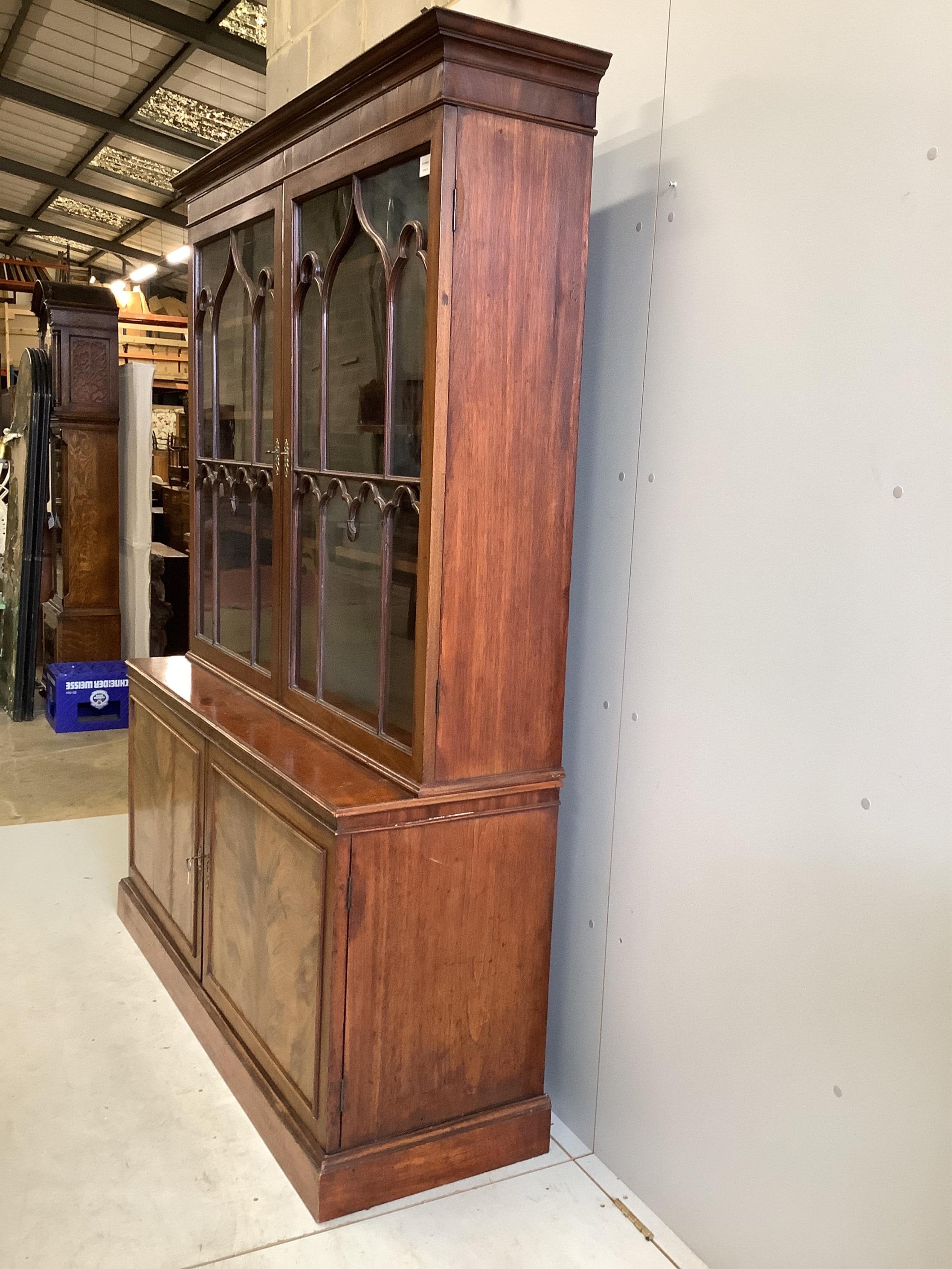 A George III mahogany bookcase, width 152cm, depth 47cm, height 203cm. Condition - fair to good